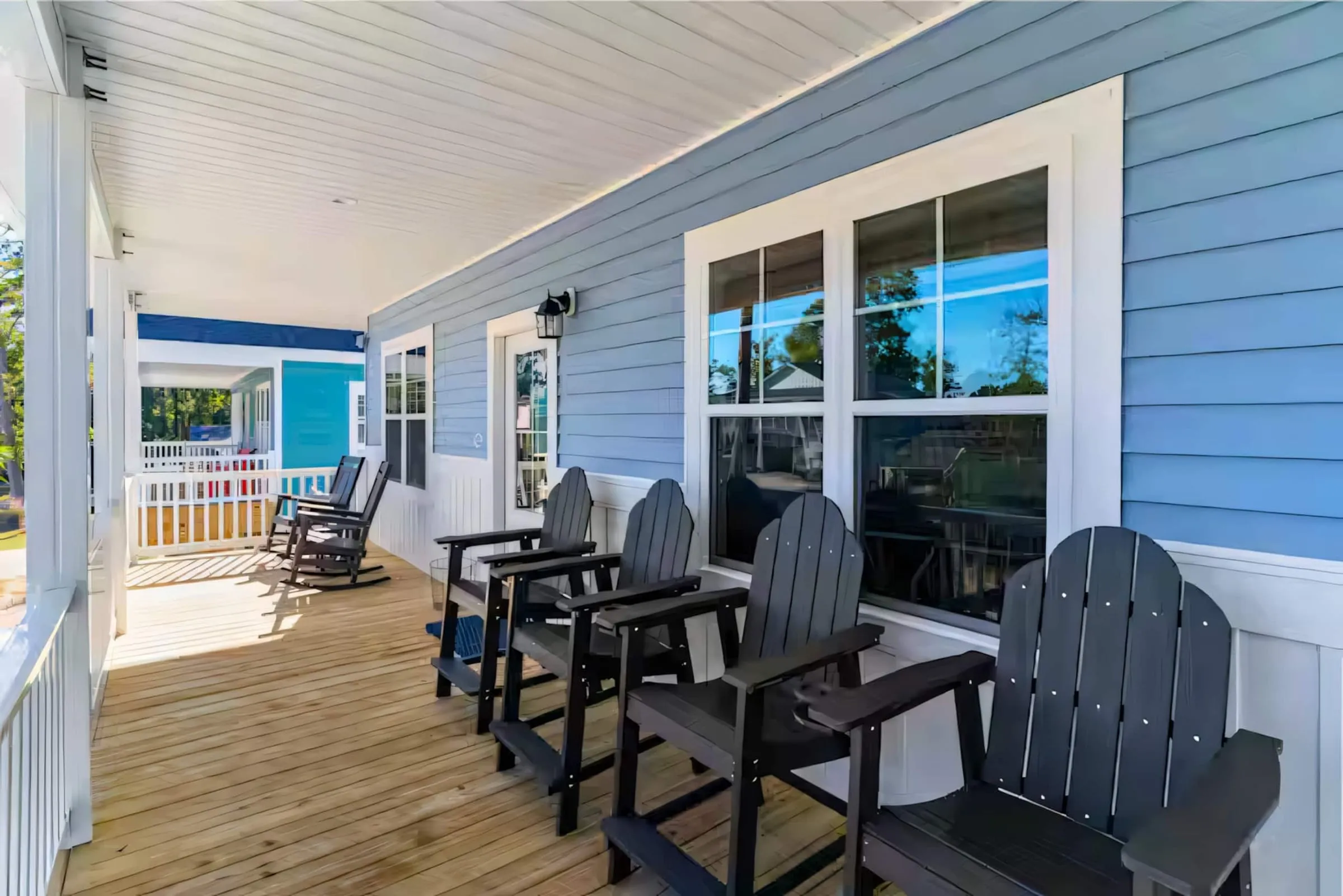 Front porch with navy rocking chairs looking out over the neighborhood